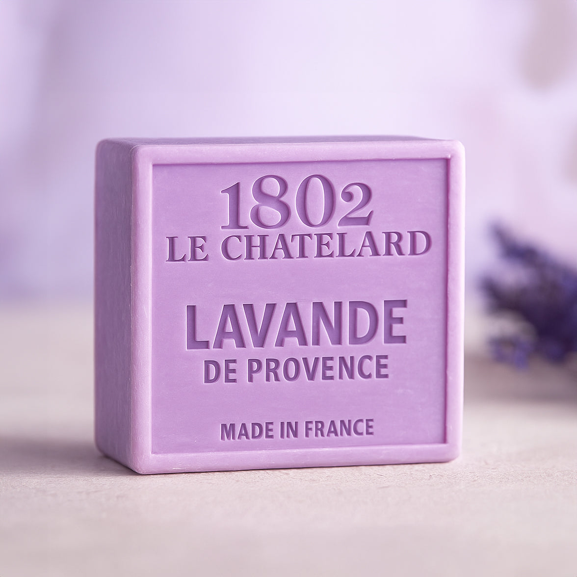 Purple soap bar with '1802 Le Chatelard' branding on a light background