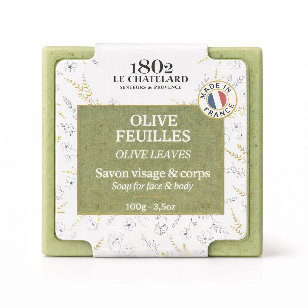 Green soap bar with white packaging featuring branding and product details on a white background