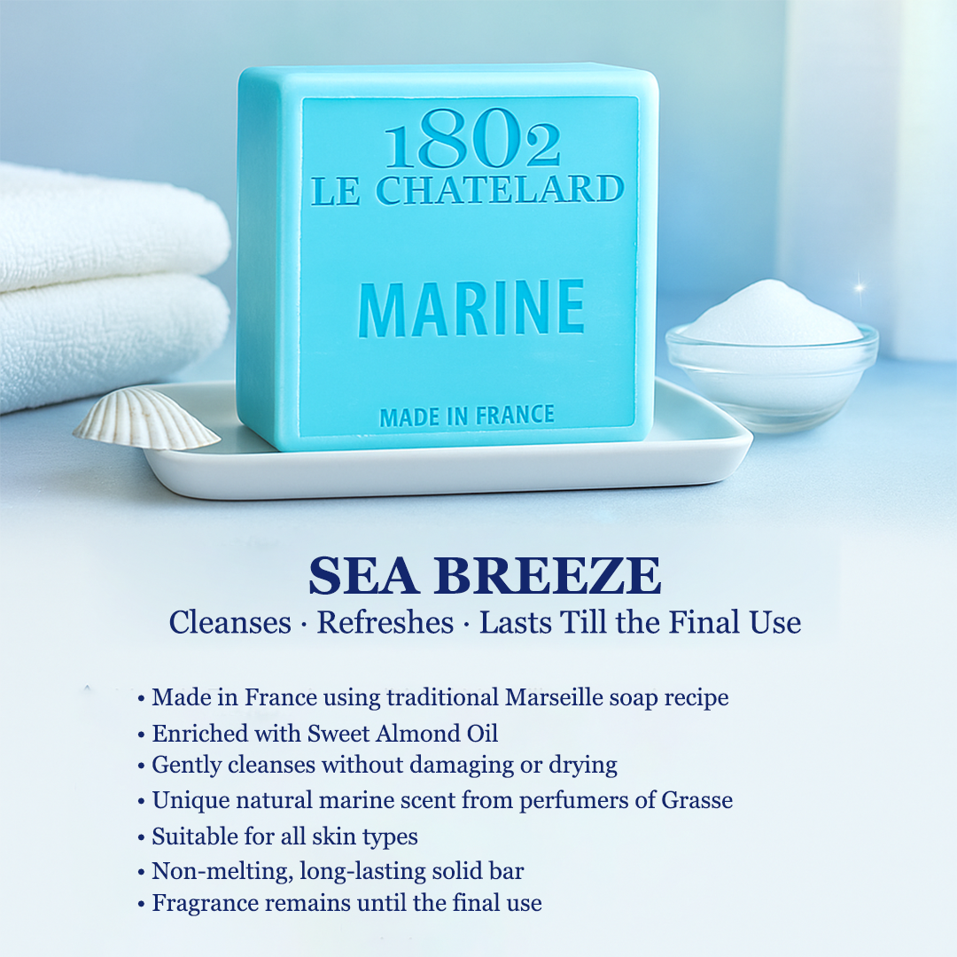 Blue soap bar with '1802 Le ChateLard' branding on a white tray, surrounded by towels and a bowl.