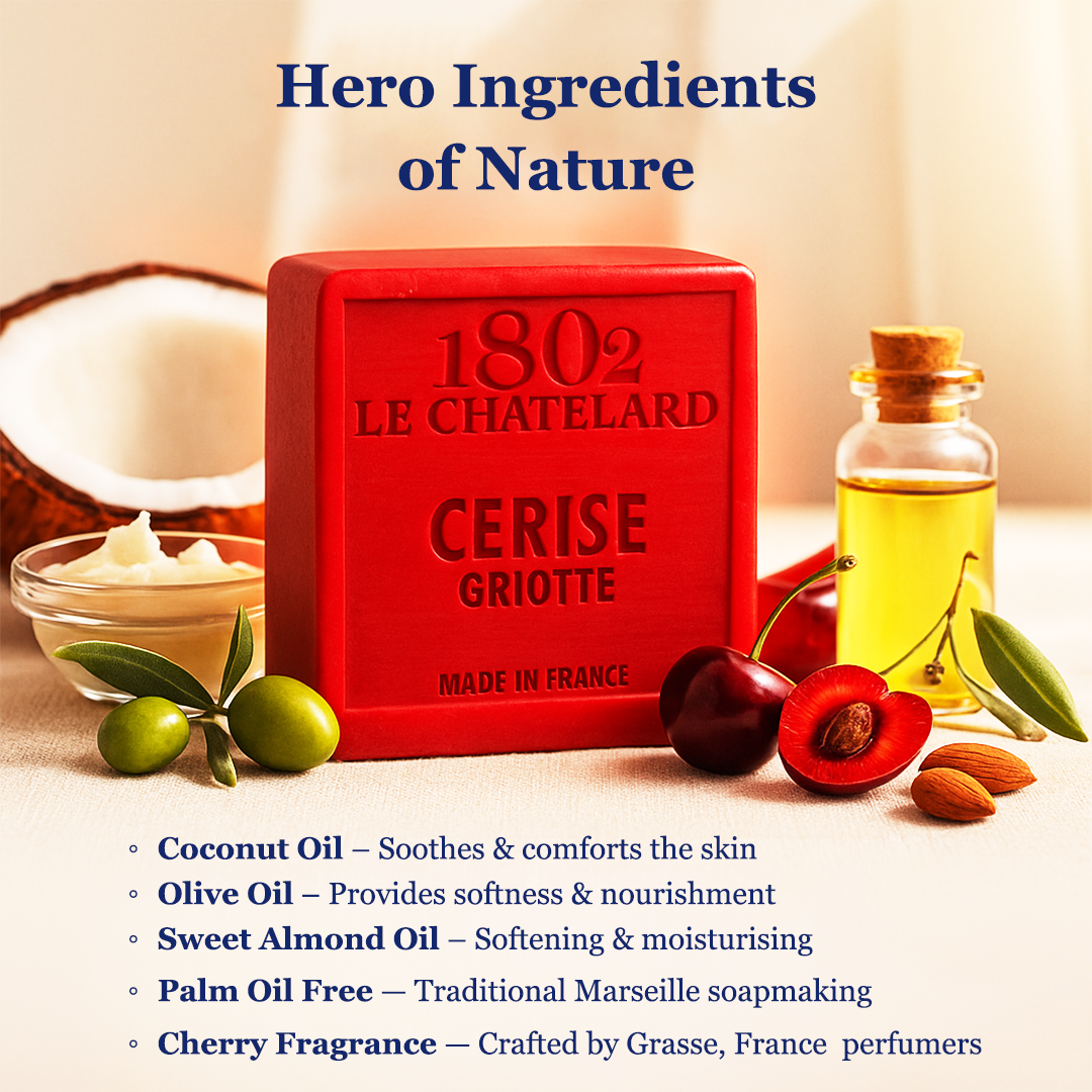 Red soap bar with ingredients like coconut, olive, and cherry on a light background