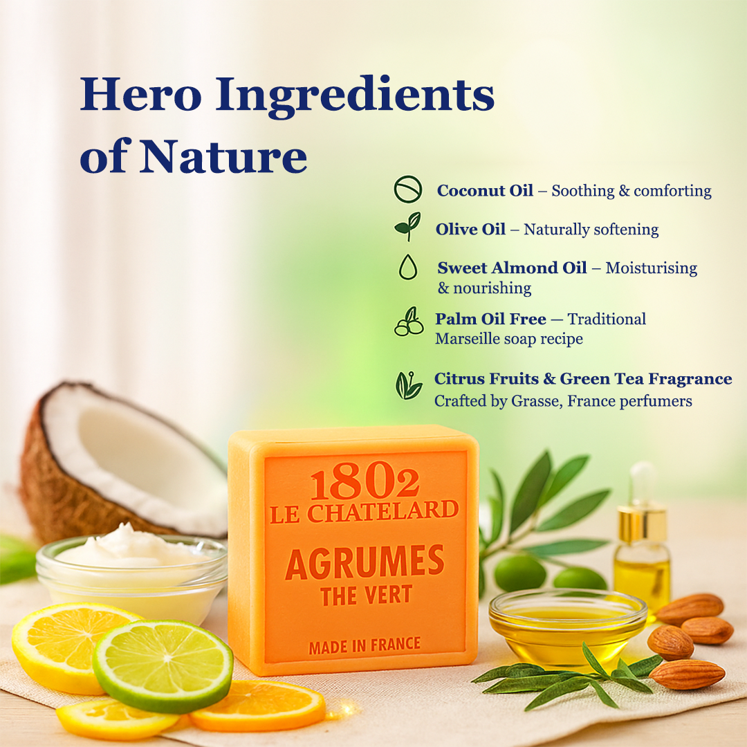 Orange soap bar with branding and natural ingredients displayed on a table.