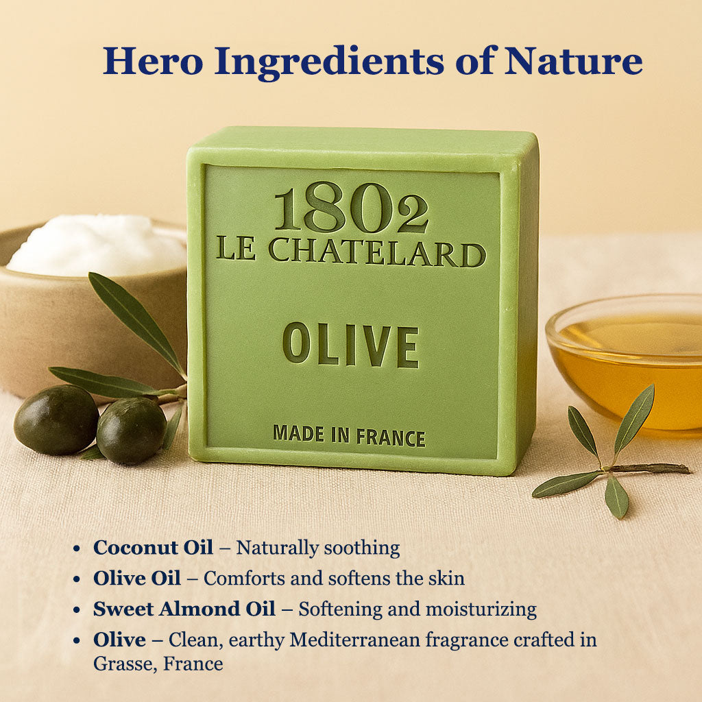 Green soap bar with '1802 Le ChateLard' branding, surrounded by olive leaves and a bowl of oil on a beige background.