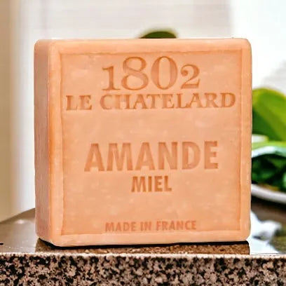 Bar of soap with '1802 Le Chatelard' branding on a marble surface.