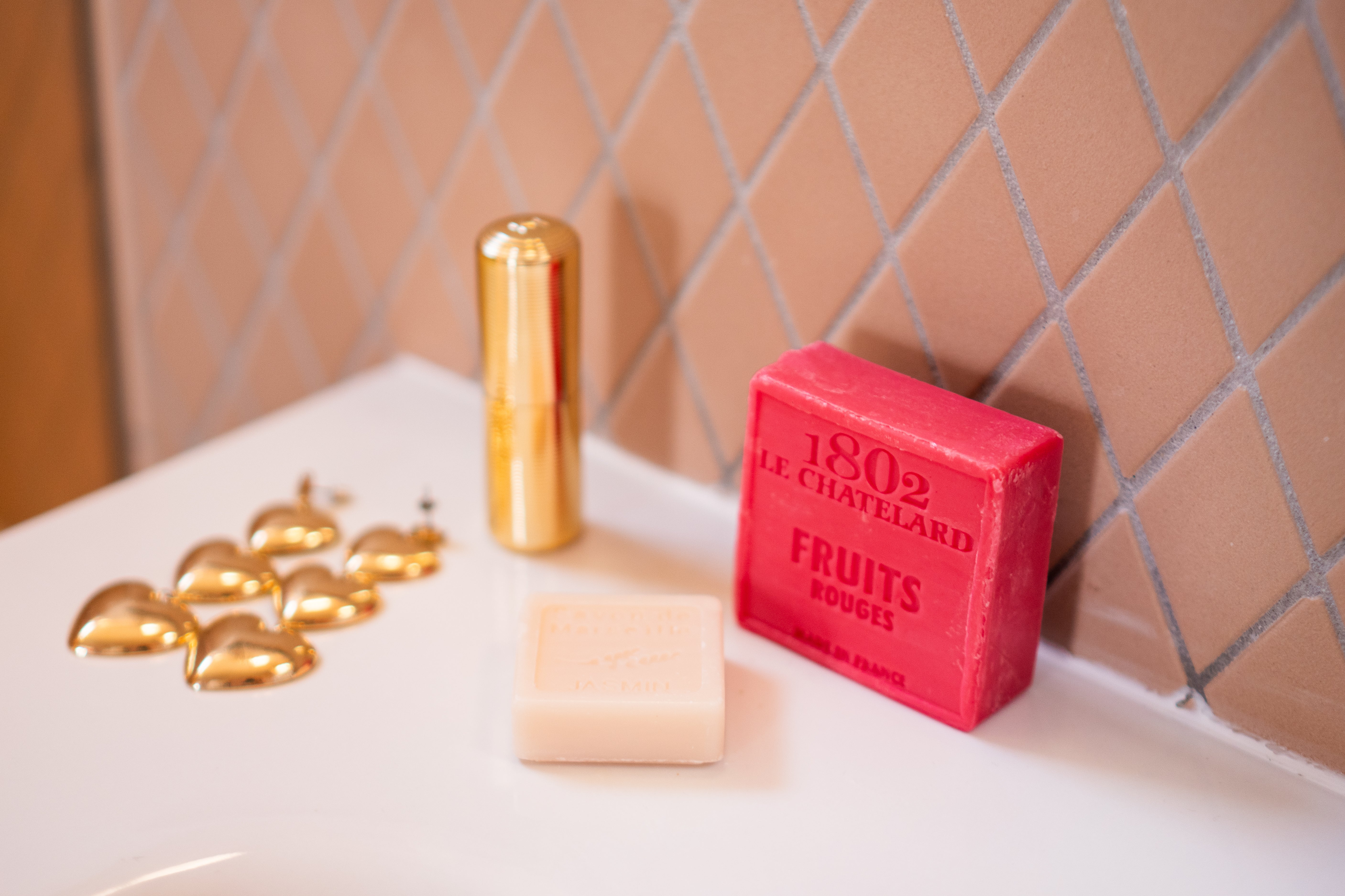 Red soap bar with '1802 Le Chatefeld' branding on a white surface with gold accents.