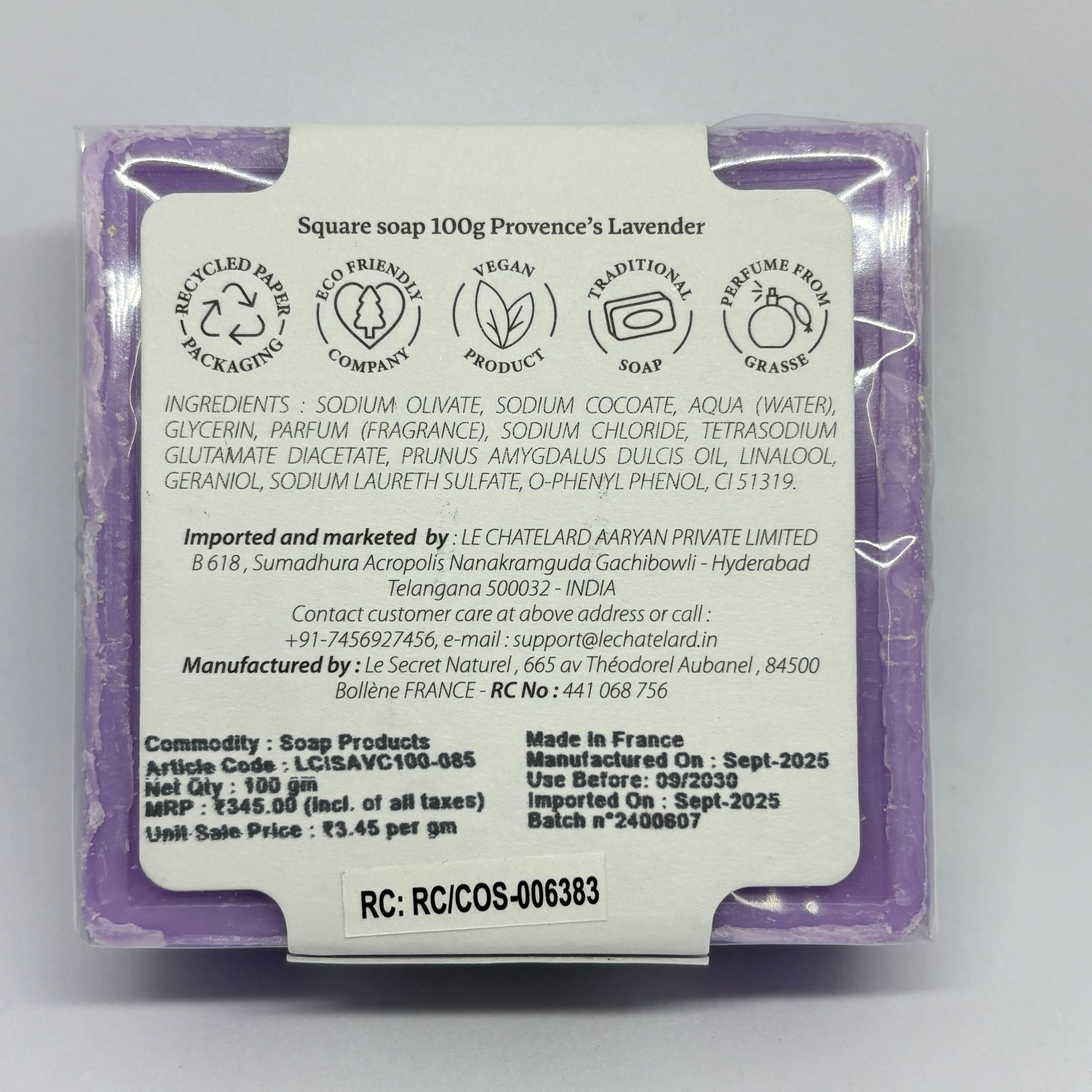 Back of a soap packaging with text and logos on a white background