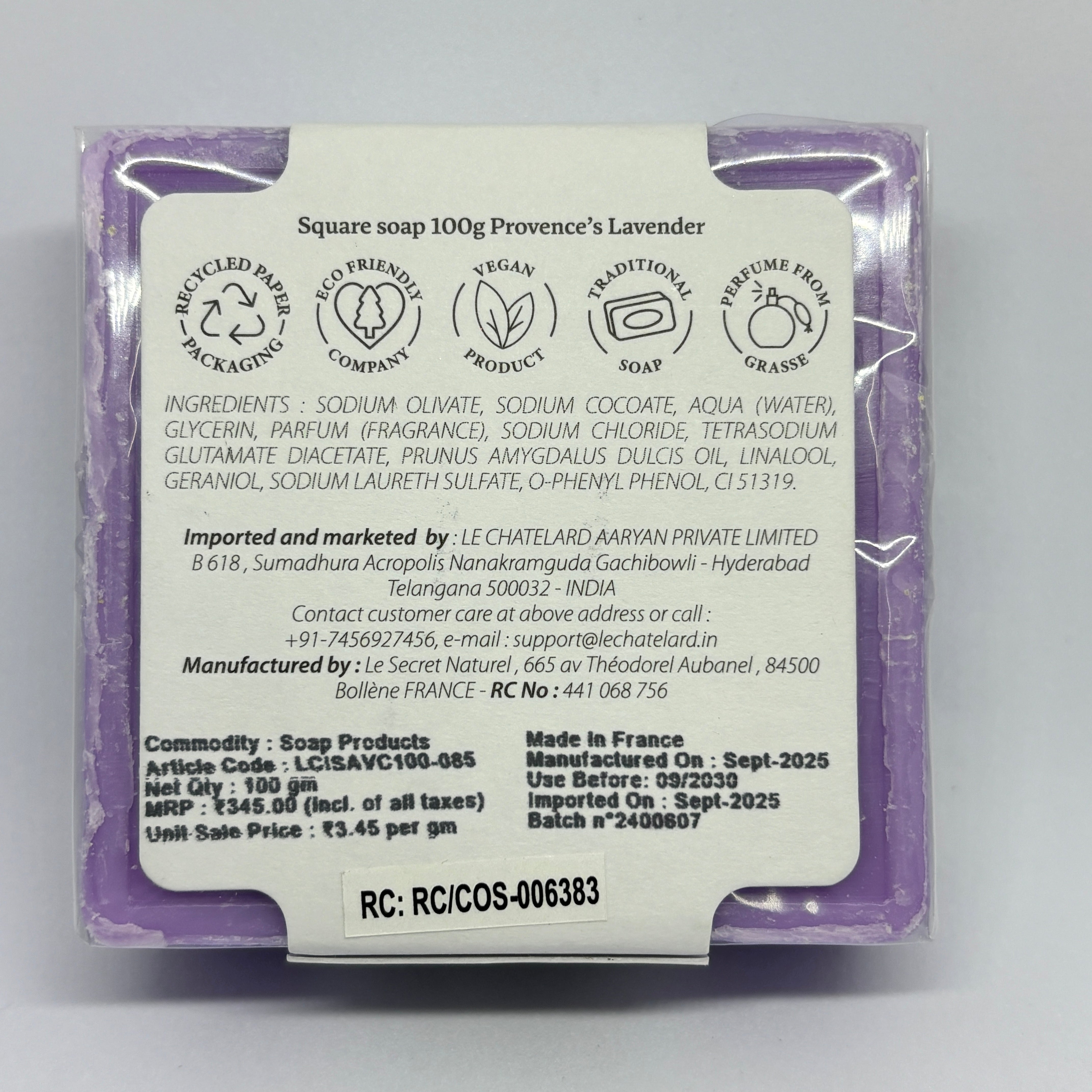 Back of a soap packaging with text and logos on a white background