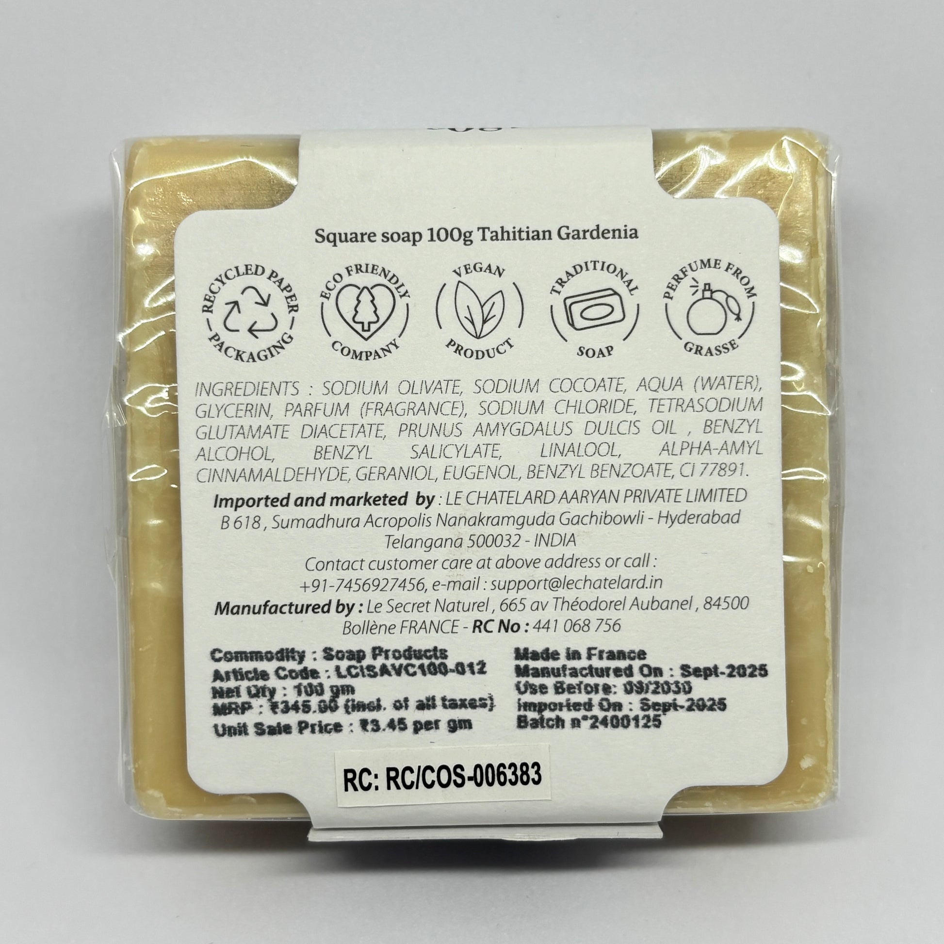 Packaged soap with a label on a gray background
