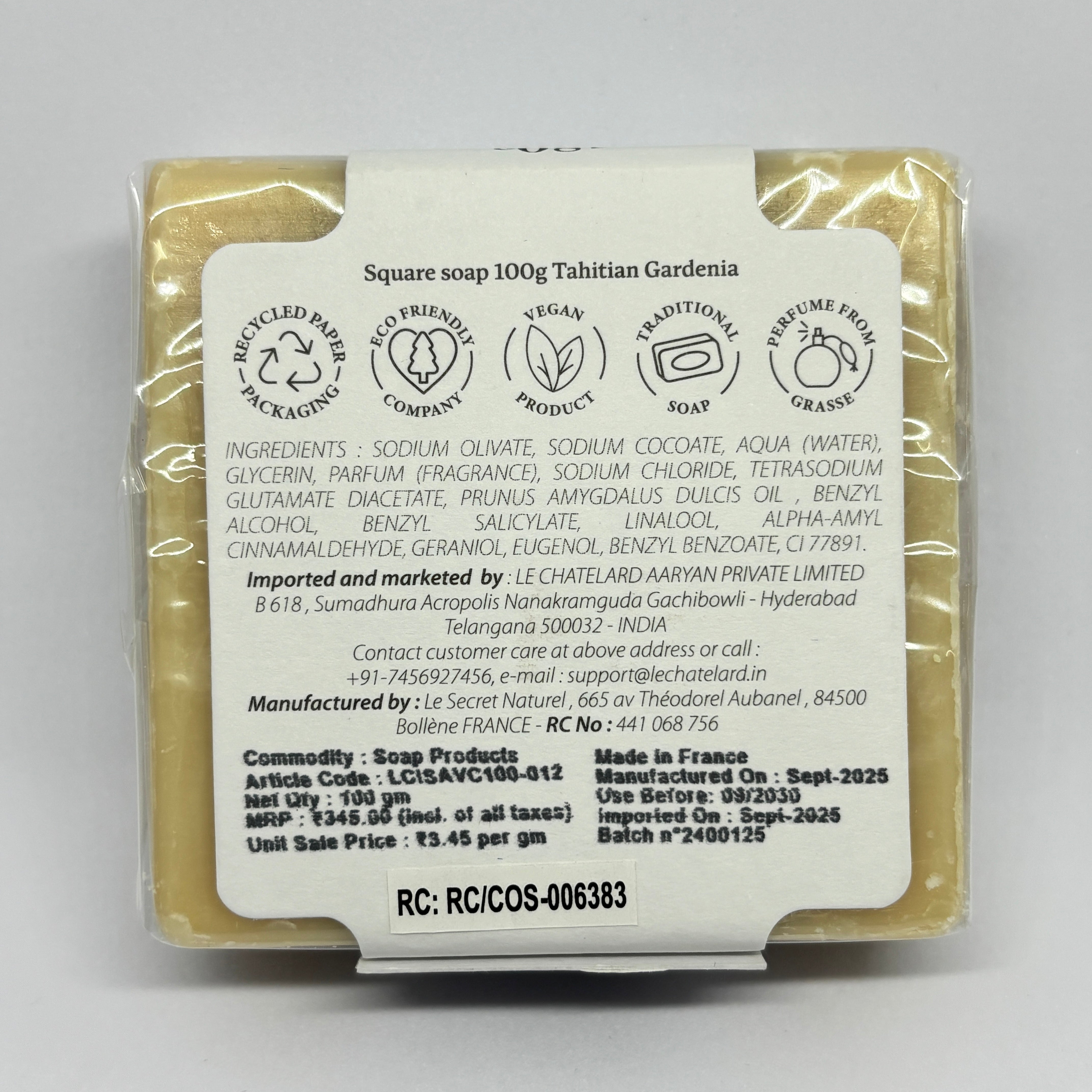 Packaged soap with a label on a gray background