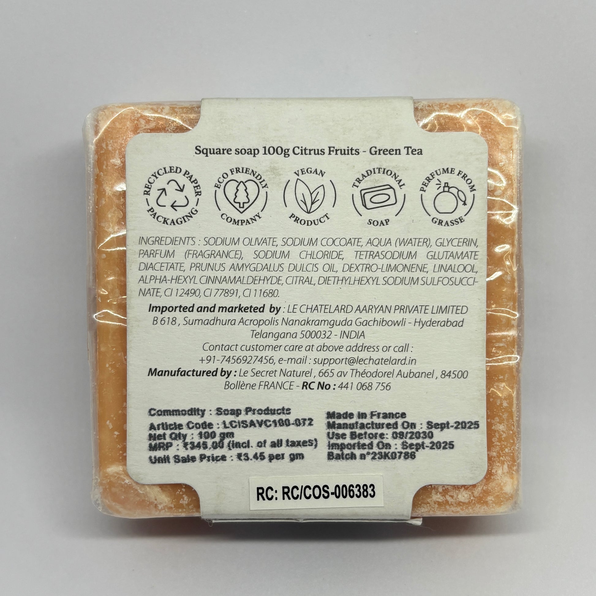 Bar of soap with a label on a gray background