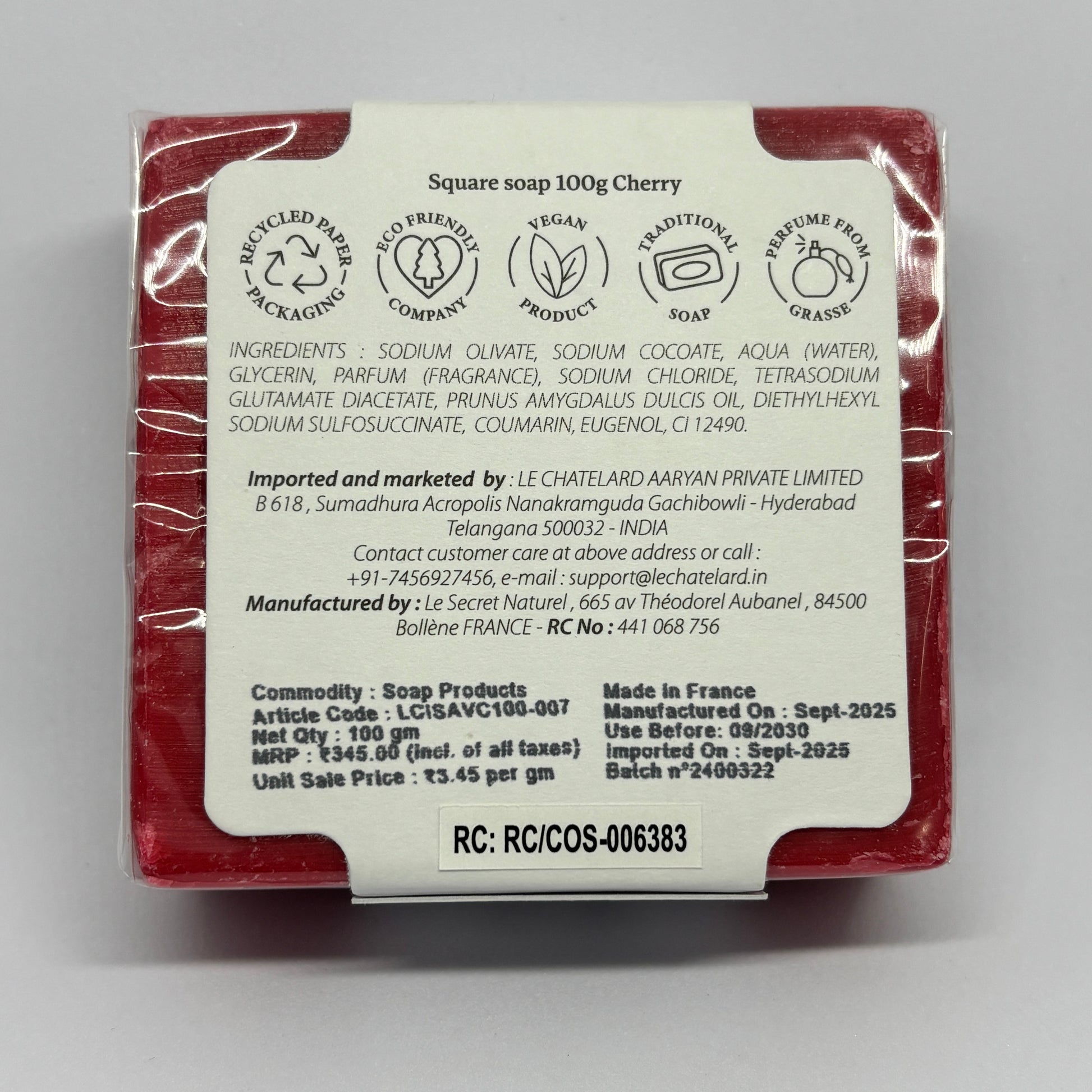 Red soap bar with a white label on a gray background