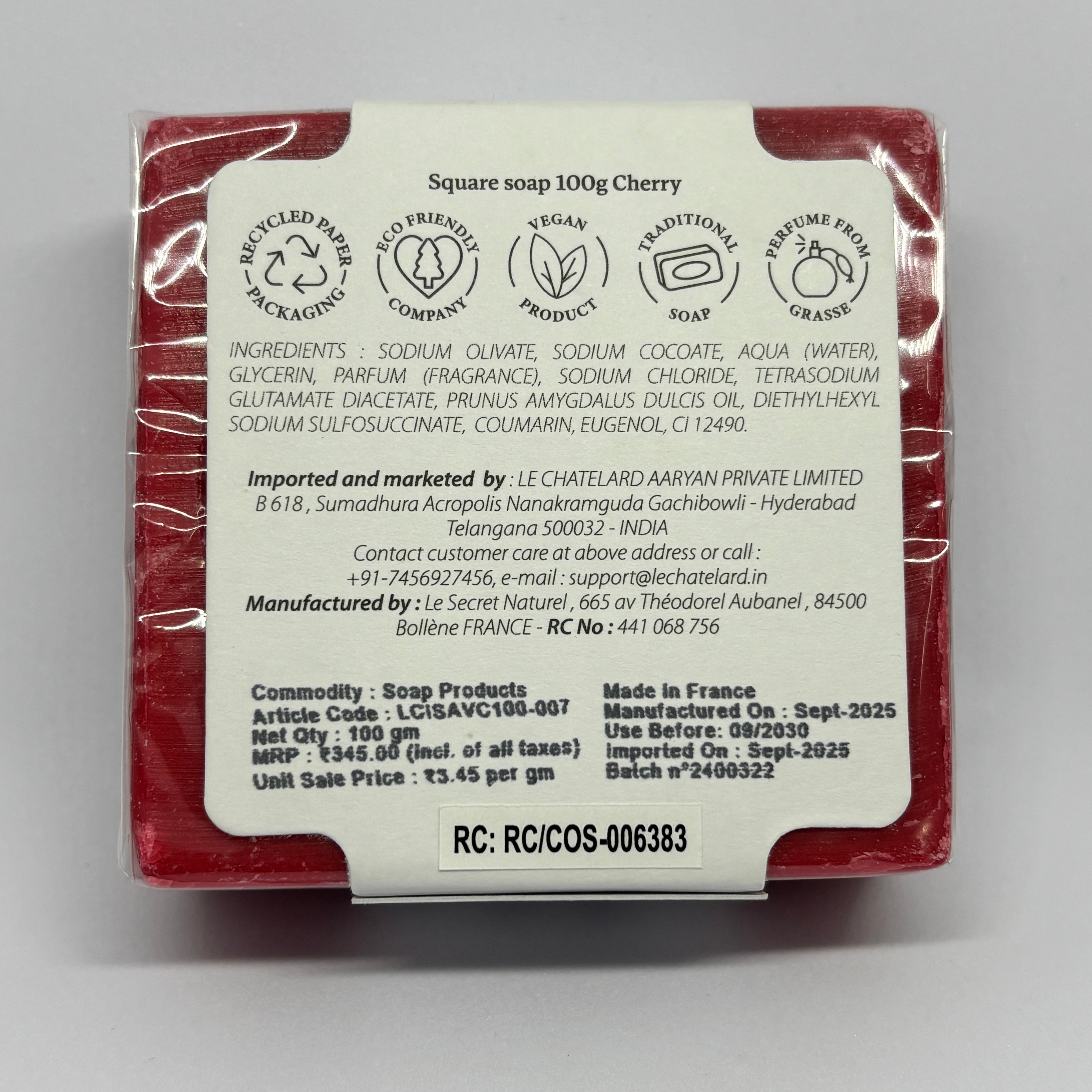 Red soap bar with a white label on a gray background