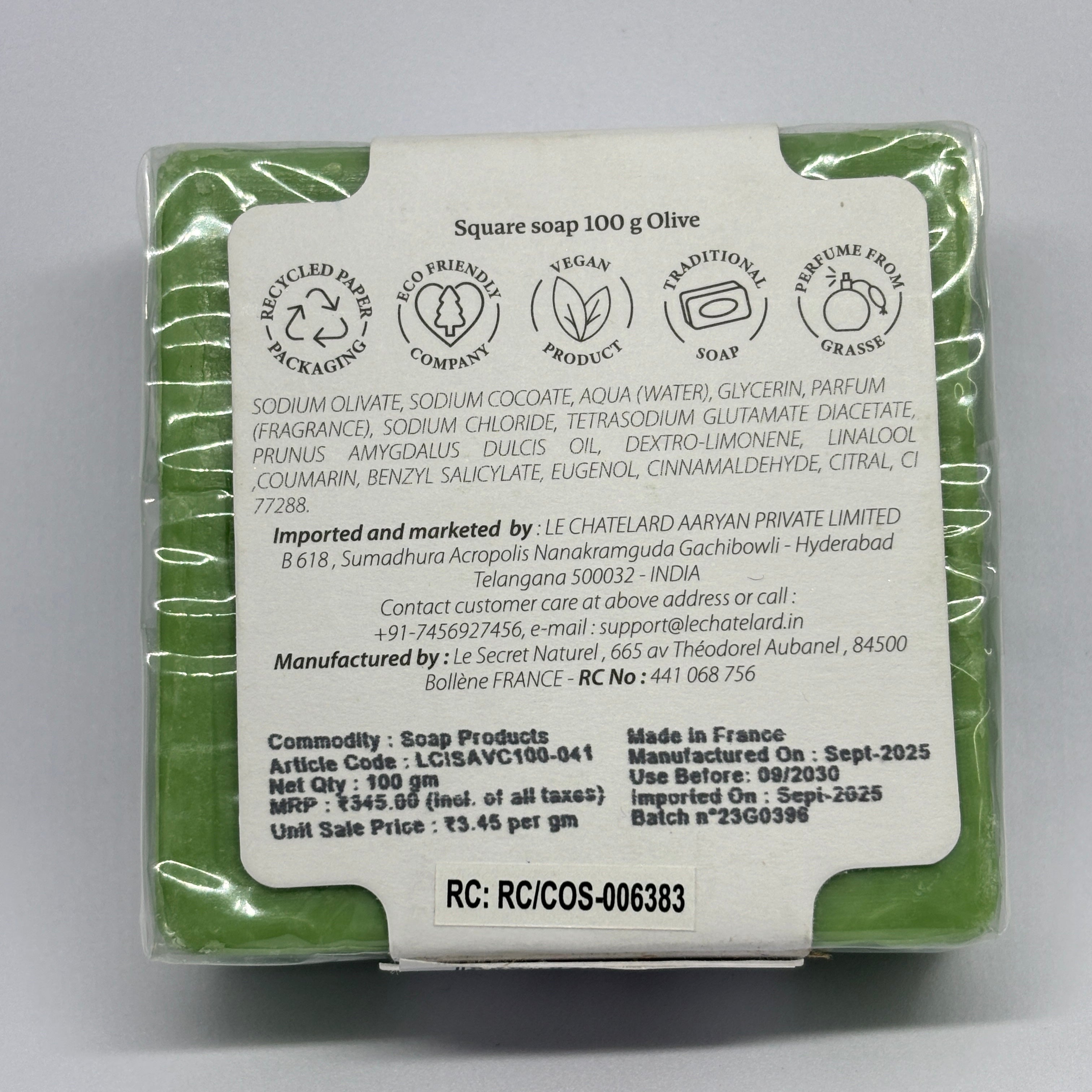 Green soap bar with a label on a gray background