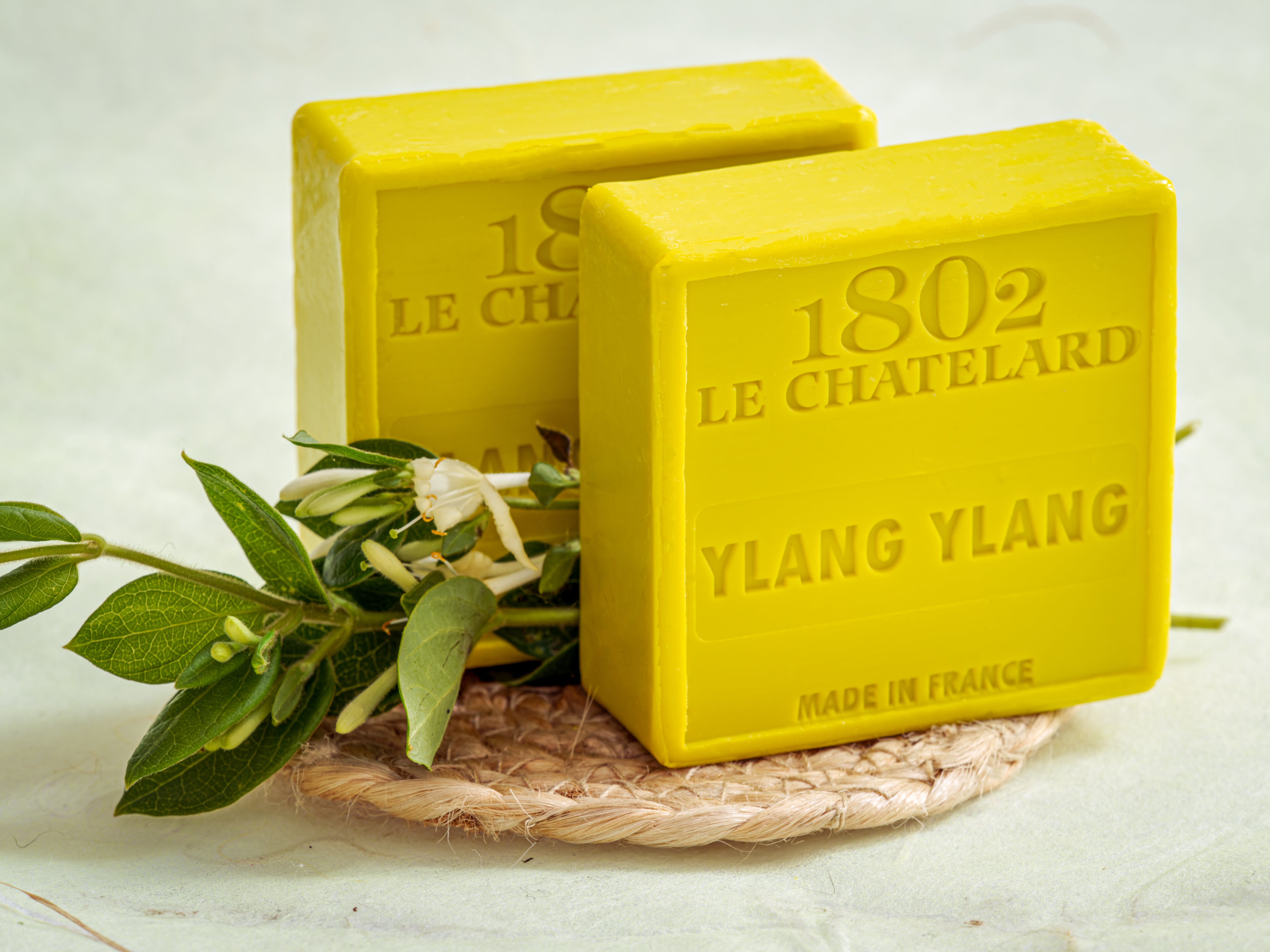 Two yellow bars of soap with 'Le Chatelard 1802' branding on a white background.