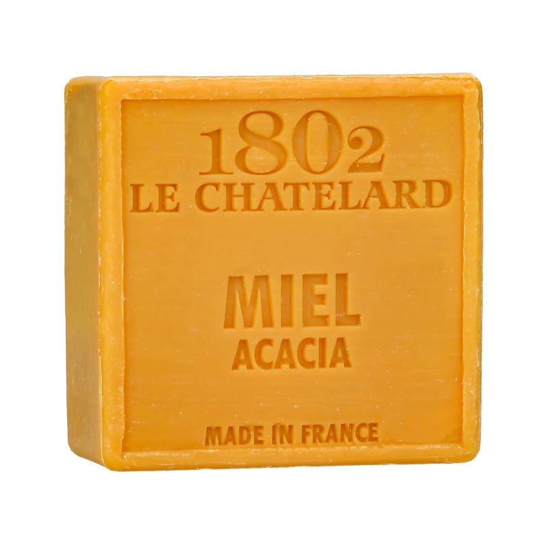 Soap bar with packaging labeled '1802 Le Chatelard' for face and body, featuring honey and acacia scents.