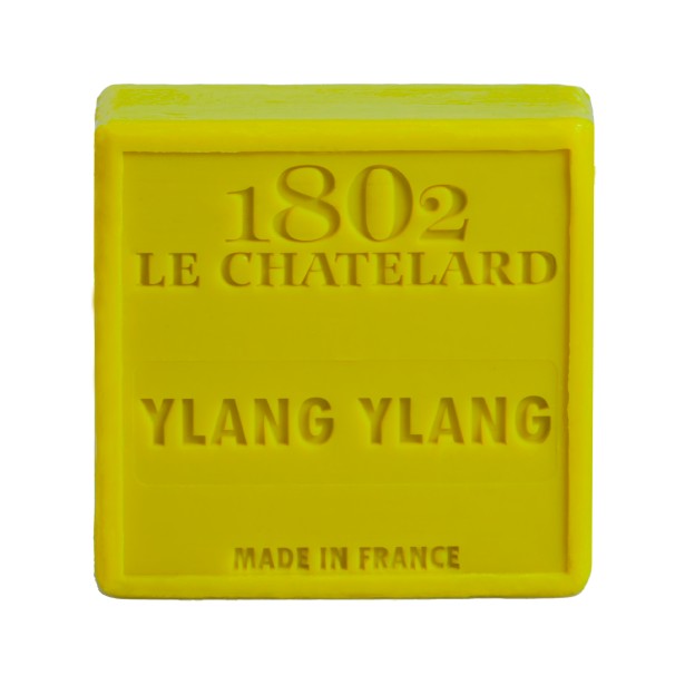 Yellow bar of soap with '1802 Le Chatelard Ylang Ylang' text on a white background